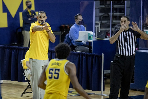 Juwan Howard and Eli Brooks (55)