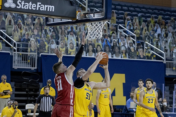 Austin Davis (51), Franz Wagner (21), Hunter Dickinson (1), and Brandon Johns Jr. (23)