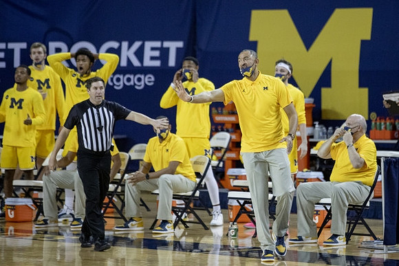 Howard Eisley, Juwan Howard, and Phil Martelli