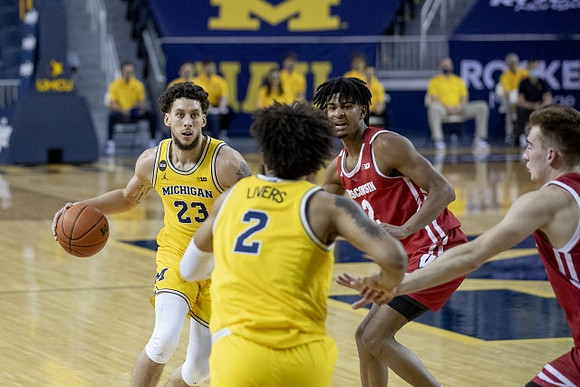 Brandon Johns Jr. (23) and Isaiah Livers (2)