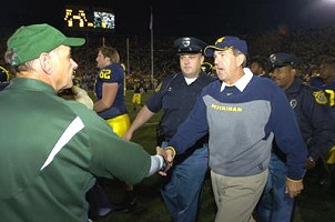John L. Smith, Lloyd Carr, and Jon Saigh