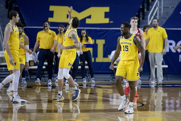 Hunter Dickinson (1), Brandon Johns Jr. (23), and Chaundee Brown Jr. (15)