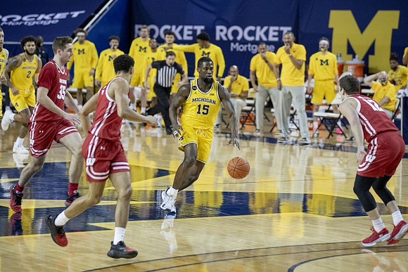 Isaiah Livers (2) and Chaundee Brown Jr. (15)
