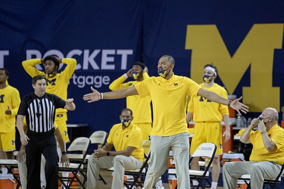 Howard Eisley, Juwan Howard, and Phil Martelli