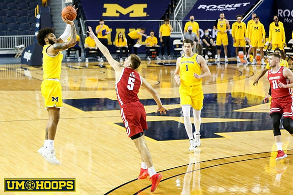 Isaiah Livers (2), Hunter Dickinson (1), and Mike Smith (12)