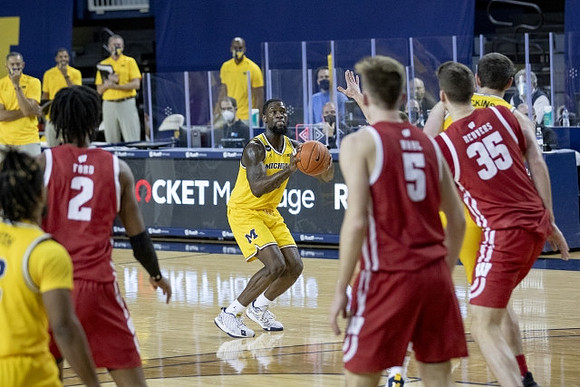 Mike Smith (12), Chaundee Brown Jr. (15), and Hunter Dickinson (1)