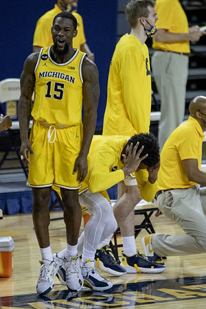 Chaundee Brown Jr. (15) and Michigan Team
