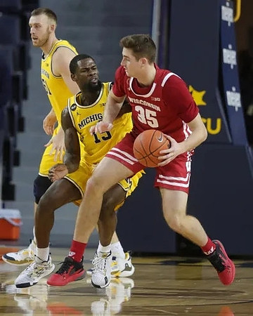 Austin Davis (51) and Chaundee Brown Jr. (15)