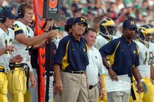 Lloyd Carr, Matt Gutierrez (12), Spencer Brinton (7), Fred Jackson, and Jermaine Gonzales (18)