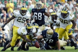 Ryan Mundy (21) , Ernest Shazor (25), Larry Harrison (96), and Grant Mason (13)