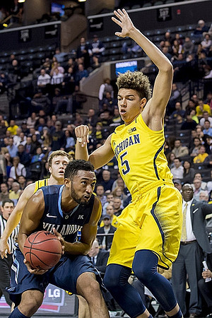 D.J. Wilson (5) and Spike Albrecht (2)