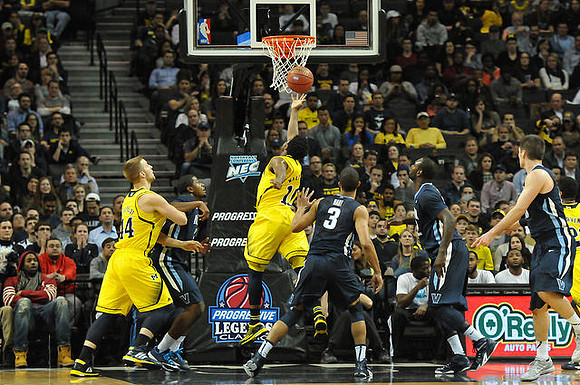 Max Bielfeldt (44) and Derrick Walton Jr. (10)