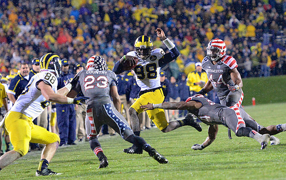Jake Butt (88) and Devin Gardner (98)