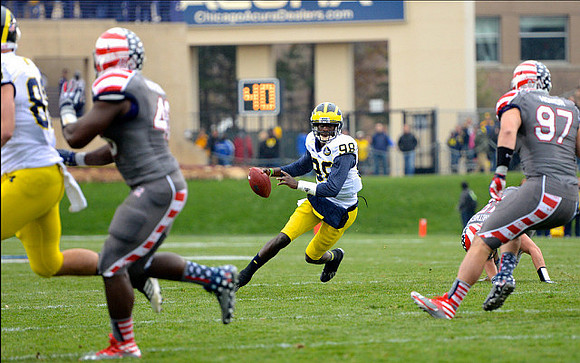 Jake Butt (88) and Devin Gardner (98)