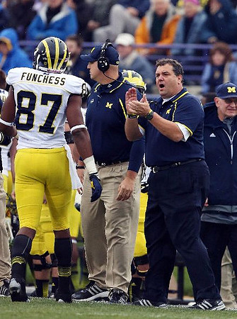 Devin Funchess (87), Brady Hoke, and Jon Falk