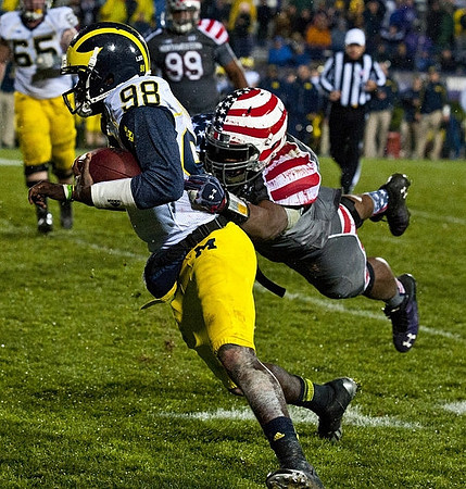 Devin Gardner (98) and Kyle Bosch (65)