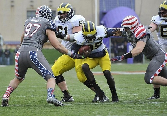Graham Glasgow (61), Devin Gardner (98), and Kyle Bosch (65)