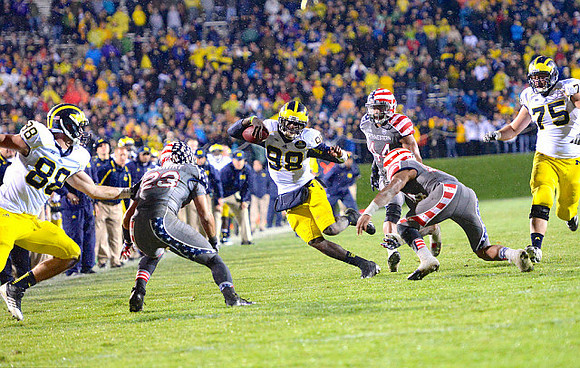 Jake Butt (88), Devin Gardner (98), and Michael Schofield (75)