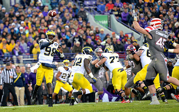Devin Gardner (98), Jeremy Gallon (21), De'Veon Smith (32), Taylor Lewan (77), and Kyle Bosch (65)