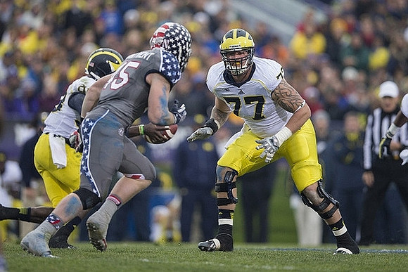 Devin Gardner (98) and Taylor Lewan (77)