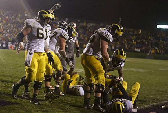 Graham Glasgow (61), Taylor Lewan (77), Jeremy Gallon (21), Kyle Bosch (65), Justice Hayes (5), and Devin Gardner (98)