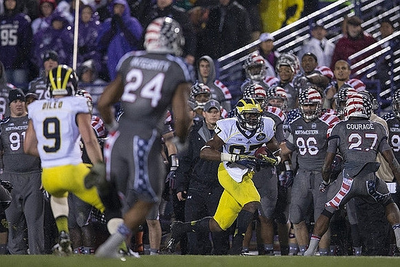 Drew Dileo (9) and Devin Funchess (87)