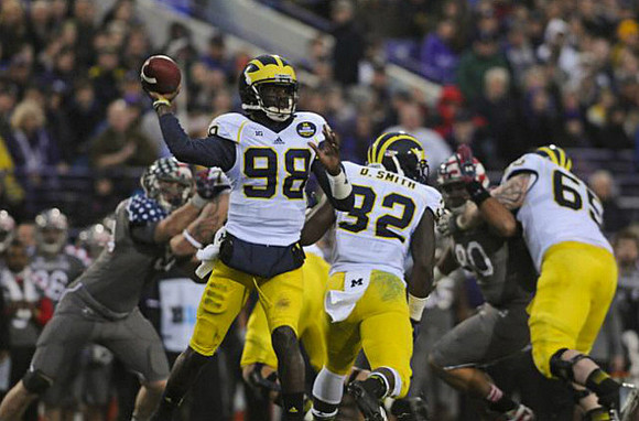 Devin Gardner (98), De'Veon Smith (32), and Kyle Bosch (65)