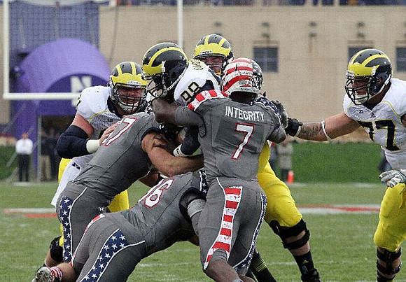 Graham Glasgow (61), Devin Gardner (98), and Taylor Lewan (77)
