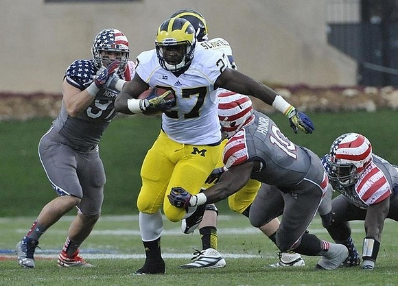 Derrick Green (27) and Michael Schofield (75)