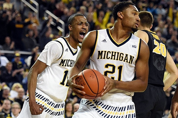 Muhammad-Ali Abdur-Rahkman (12) and Zak Irvin (21)