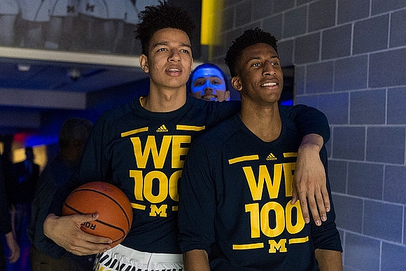 D.J. Wilson (5) and Aubrey Dawkins (24)