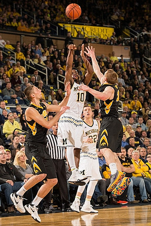Derrick Walton Jr. (10) and Duncan Robinson (22)