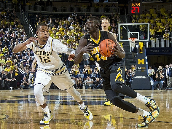 Muhammad-Ali Abdur-Rahkman (12) and Mark Donnal (34)