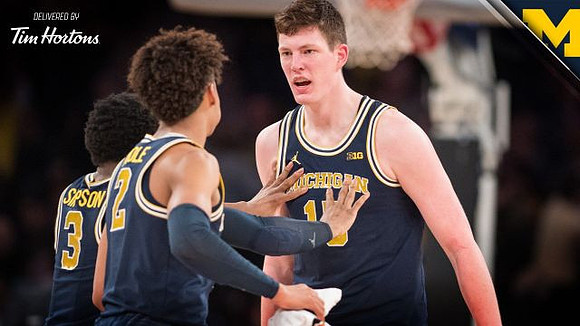 Zavier Simpson (3), Jordan Poole (2), and Jon Teske (15)