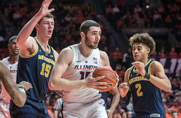 Jon Teske (15) and Jordan Poole (2)