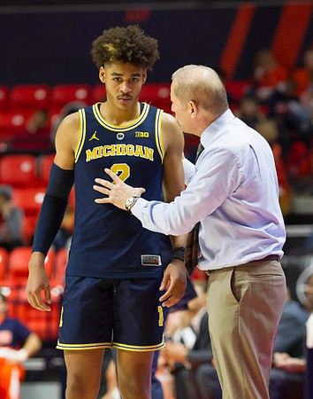 Jordan Poole (2) and John Beilein