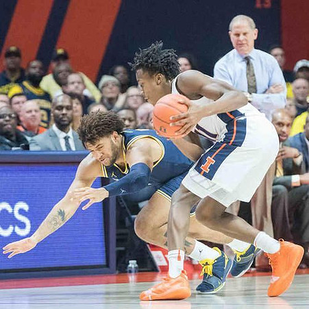 Isaiah Livers (4) and John Beilein
