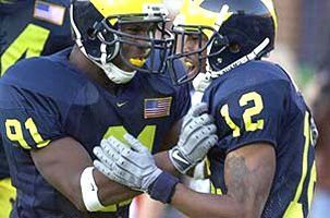Emmanuel Casseus (91) and Brandon Williams (12)