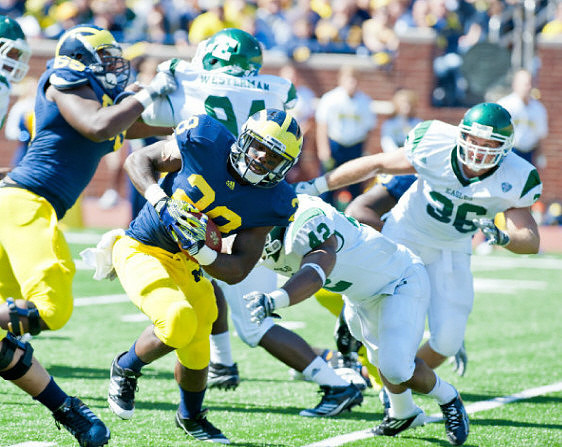 Brandon Moore (89) and Fitzgerald Toussaint (28)