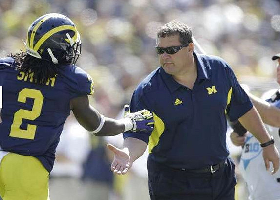 Vincent Smith (2) and Brady Hoke