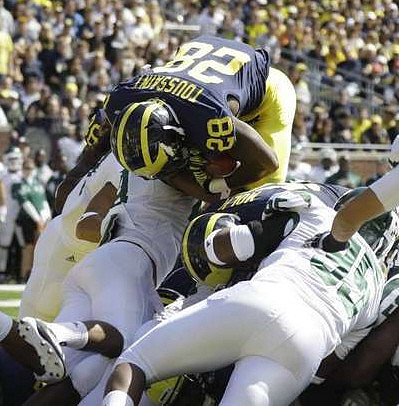 Fitzgerald Toussaint (28) and David Molk (50)