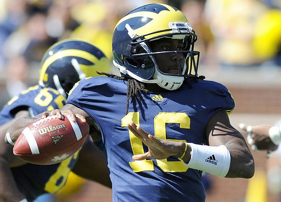 Patrick Omameh (65) and Denard Robinson (16)