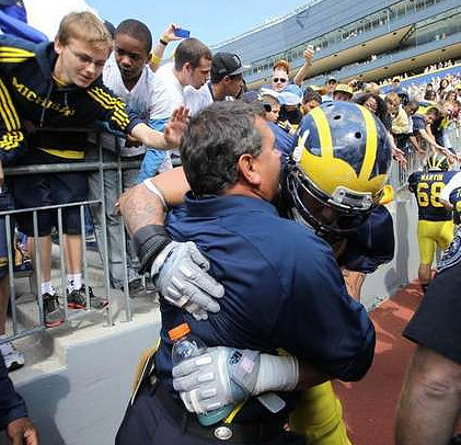 Brady Hoke and Taylor Lewan (77)