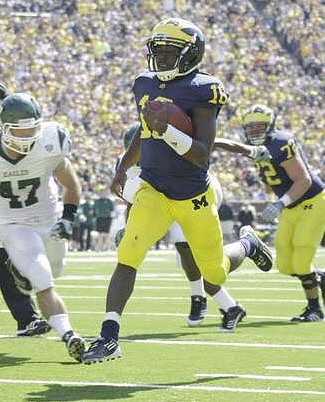 Denard Robinson (16) and Taylor Lewan (77)