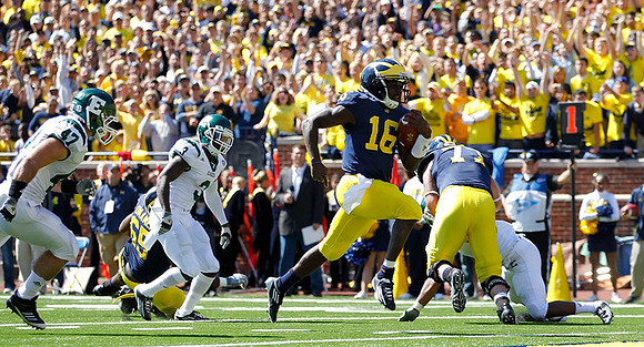 Patrick Omameh (65), Denard Robinson (16), and Taylor Lewan (77)
