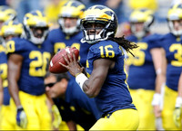 Denard Robinson (16), Michael Shaw (20), and Brady Hoke