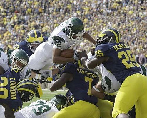 Thomas Gordon (30), Jordan Kovacs (32), Brandin Hawthorne (7), and Kenny Demens (25)