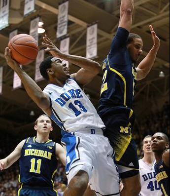 Nik Stauskas (11), Zak Irvin (21), and Glenn Robinson III (1)