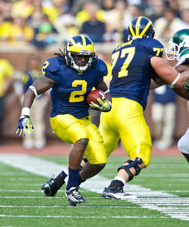 Vincent Smith (2) and Taylor Lewan (77)