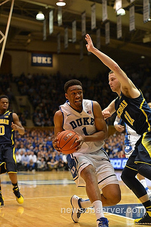 Derrick Walton Jr. (10) and Nik Stauskas (11)